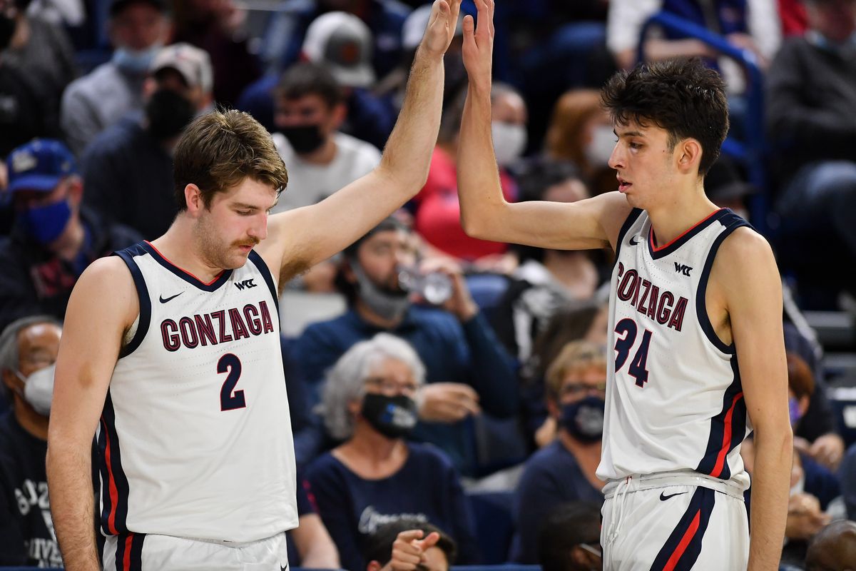 Gonzaga Bulldogs forward Drew Timme (2) high-fives center Chet Holmgren as Holmgren heads to the bench during the second half of Sunday’s exhibition game against Eastern Oregon at McCarthey Athletic Center. Gonzaga won the game 115-62.  (Tyler Tjomsland/The Spokesman-Review)