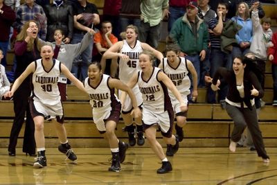 Katie Sanders (30), Shaneya Valdez (20), Brigitte Boucher (45), Natalie Nichols (12), Lauren Boyd-Miller (32), and Deanna Dotts rush the court after NIC’s win. Special to  (Bruce Twitchell Special to / The Spokesman-Review)