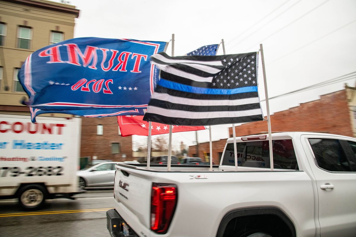 A President Trump supporter drives up Monroe Street as part the Save the Republic, Stop the Steal rally, Wed., Jan. 2021.  (COLIN MULVANY/THE SPOKESMAN-REVIEW)