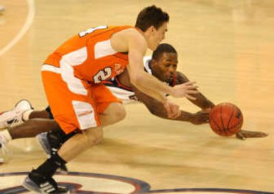 
Gonzaga's Jeremy Pargo dives for a loose ball against Pepperdine's Mike Hornbuckle in the first half. 
 (Rajah Bose / The Spokesman-Review)