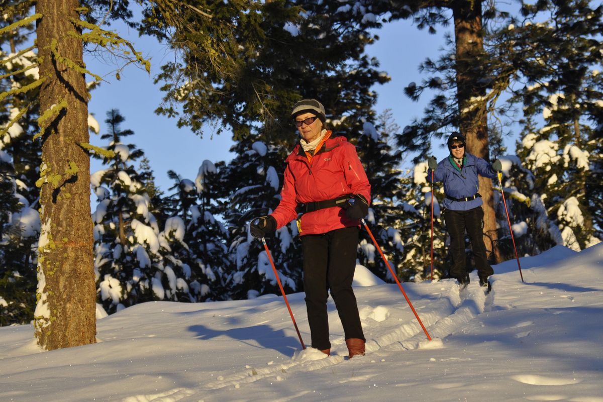Cross-country skiers Karen McKinney and Meredith Heick break trail for a tour off the groomed tracks in the Methow Valley. (Rich Landers / The Spokesman-Review)