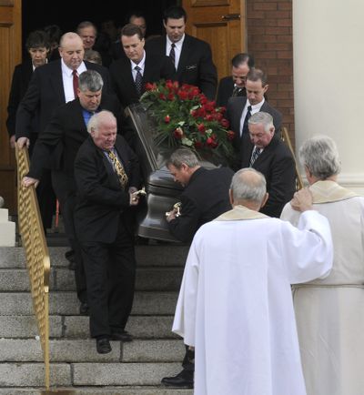 Harry Magnuson’s casket is carried down the steps of St. Aloysius Church after his funeral Thursday in Spokane.   (Dan Pelle / The Spokesman-Review)