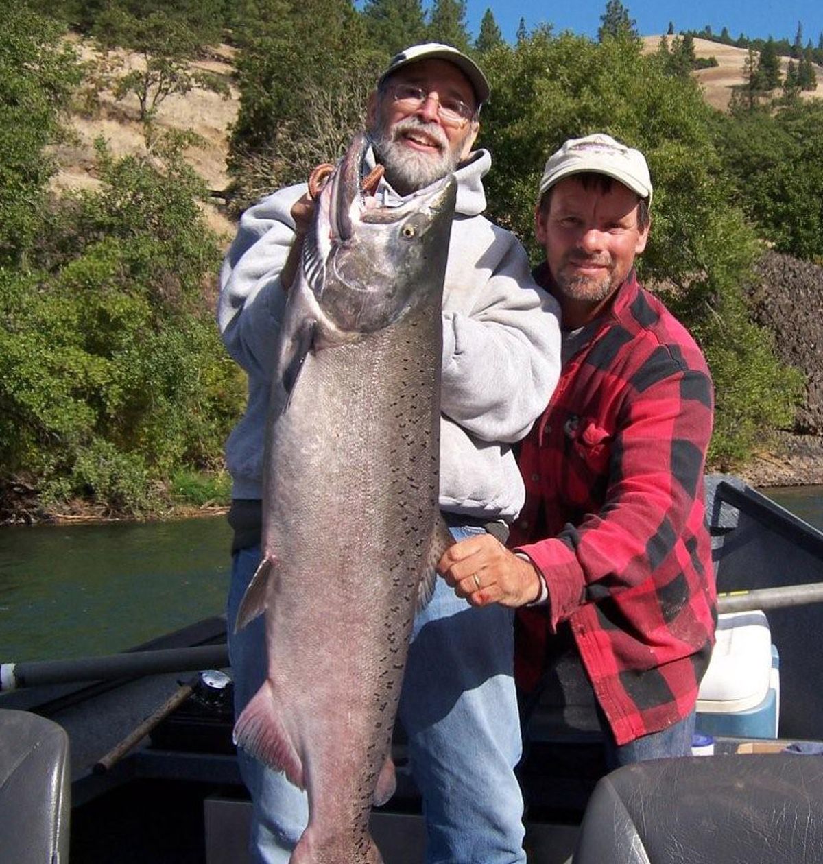 Tracy Zoller, owner of Adventure Fishing guide service based in Klickitat, Wash., helped his client, Ray Fitzsimmons of White Salmon, Wash., land this fall chinook salmon on the Klickitat River in September. Photo courtesy of Adventure Fishing (Photo courtesy of Adventure Fishing / The Spokesman-Review)
