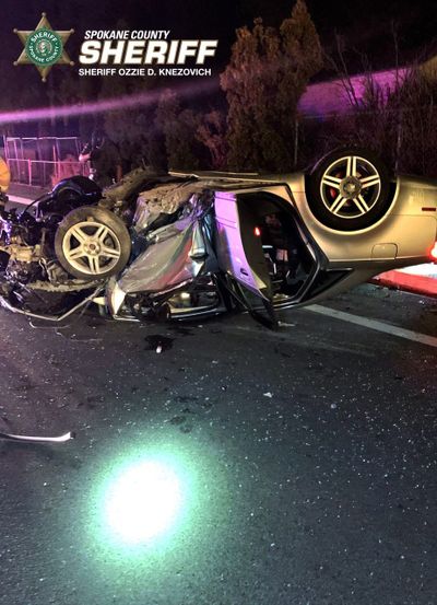 A vehicle rests on its top after it rolled Thursday night on University Road and 35th Avenue in Spokane Valley. Two people were seriously injured and the driver, 21-year-old Kyle R. Stenico, was taken to the hospital and then to jail on suspicion of two counts of vehicular assault.   (COURTESY OF SPOKANE COUNTY SHERIFF'S OFFICE)