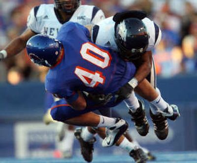 
Nevada's Ezra Butler takes down Boise State TE Richie Brockel. Associated Press
 (Associated Press / The Spokesman-Review)