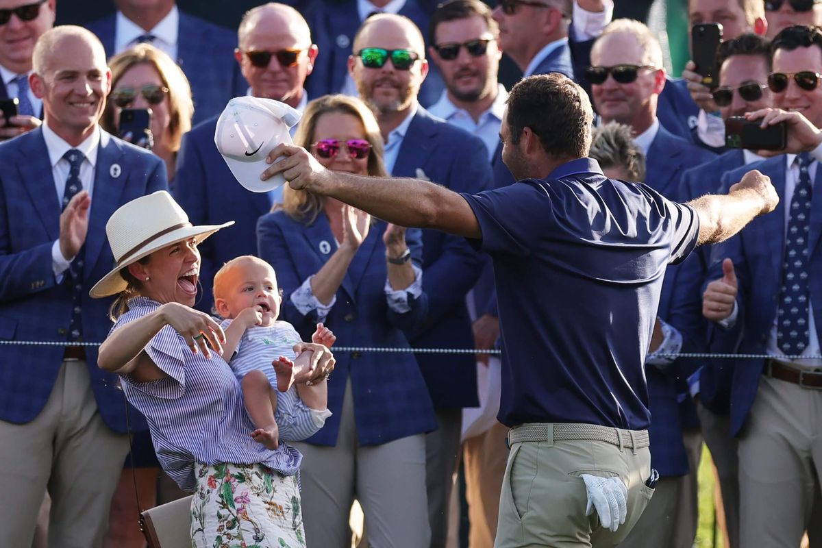 Scottie Scheffler, right, is joined by his wife Meredith and son Bennett after winning the PGA Championship in May.  (Getty Images)