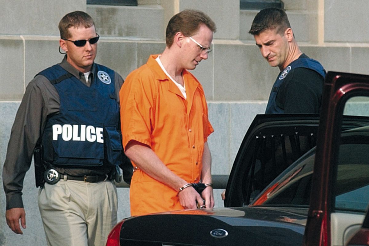 FILE - In this Aug. 18, 2004 file photo, Dustin Honken is led by federal marshals to a waiting car after the second day of jury selection in federal court in Sioux City, Iowa. A federal judge has denied the Iowa drug kingpin