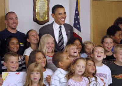 Sen. Barack Obama  poses with children from a youth program Tuesday while touring the East Community Ministry in Zanesville, Ohio.Associated Press
 (Associated Press / The Spokesman-Review)