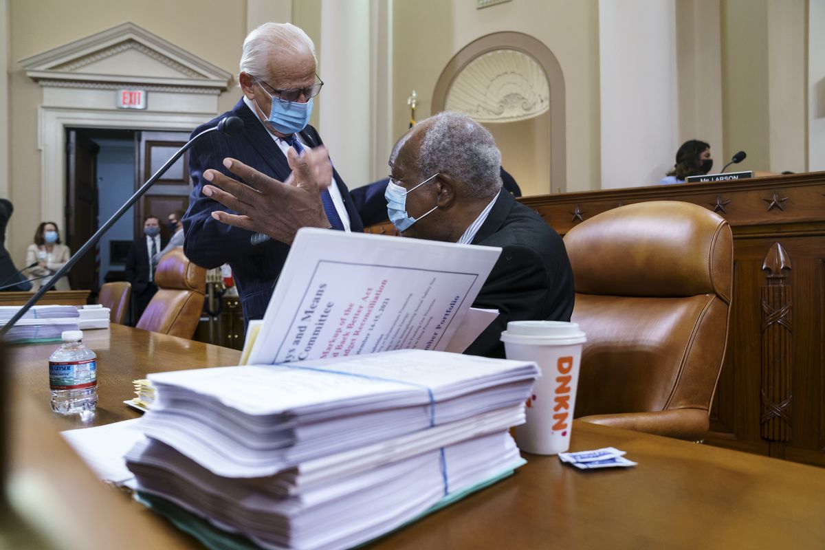 Rep. Bill Pascrell, D-N.J., left, and Rep. Danny Davis, D-Ill., confer as the tax-writing House Ways and Means Committee continues working on a sweeping proposal for tax hikes on big corporations and the wealthy to fund President Joe Biden
