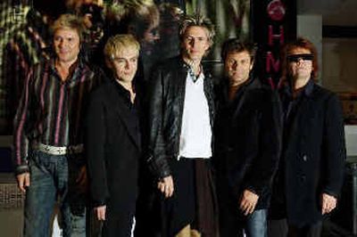 
From left, Simon LeBon, Nick Rhodes, John Taylor, Roger Taylor, and Andy Taylor from pop group Duran Duran pose for photographers during an in-store appearance in London this month. 
 (Associated Press / The Spokesman-Review)