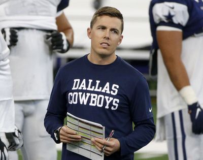 Dallas Cowboys offensive coordinator Kellen Moore watches practice during an NFL football training camp in Arlington, Texas.   (Associated Press)