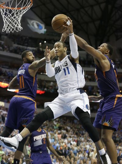 Mavericks guard Monta Ellis poured in 37 points in helping Dallas clinch a spot in the playoffs for the 13th time in 14 seasons. (Associated Press)