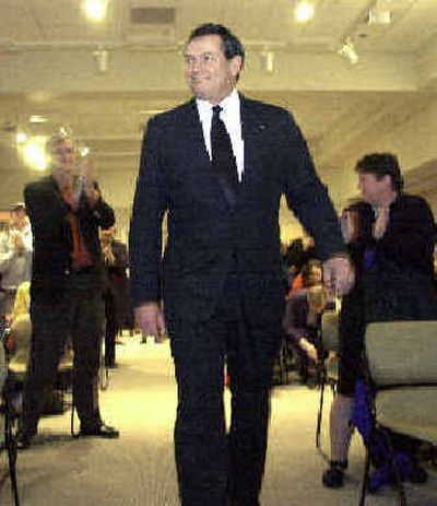 
Dr. Timothy White walks into a standing ovation after being announced as the new president of the University of Idaho Wednesday, Feb 18, 2004. Dr. Timothy White walks into a standing ovation after being announced as the new president of the University of Idaho Wednesday, Feb 18, 2004. 
 (File/File/ / The Spokesman-Review)