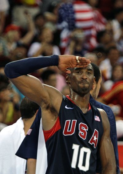 USA’s Kobe Bryant salutes the crowd as he celebrates after beating Spain 118-107. (Associated Press / The Spokesman-Review)