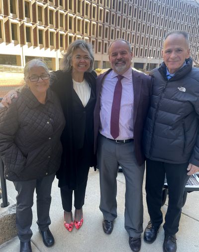 Michael Sullivan, seen at the far right, stands with, from left, his sister Donna Faria and his attorneys Lisa Parlagreco and Michael Heineman after winning a $13 million judgement at Suffolk Superior Court on Tuesday for being locked up for 26 years.  (Michael Heineman/TNS)