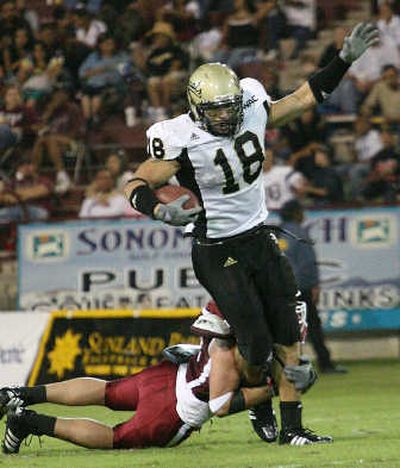 
NMSU's Nick Ply hauls down Idaho's A.J. Harris during first-half action. Associated Press
 (Associated Press / The Spokesman-Review)