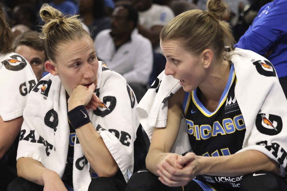 Chicago Sky guards Courtney Vandersloot, left, and Allie Quigley talk on the bench in the third quarter against the Connecticut Sun in Game 2 of the WNBA semifinals on Aug. 31, 2022, at Wintrust Arena.  (Tribune News Service)