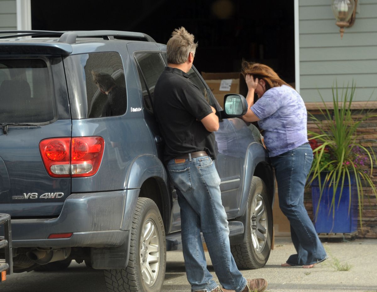 When confronted by a reporter, Doris "Dee" Nelson, right, breaks down crying while her husband Dennis, left, looks on at their rural home in north of Colbert Thursday, Sept. 22, 2011.  Federal prosecutors filed a 110-count felony indictment Thursday, Nov. 17, against Dee Nelson, architect of an alleged international Ponzi scheme that netted $126 million to prop up payday lender Little Loan Shoppe. (Jesse Tinsley / The Spokesman-Review)