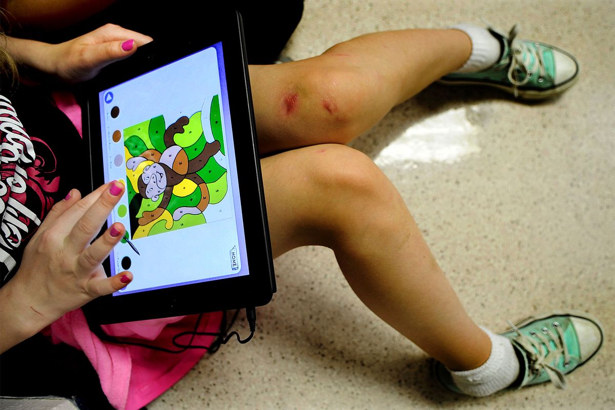 Hayden Meadows Elementary second-grader Josey Damron works on an iPad during class on Tuesday in Hayden. Students, parents and teachers are embarking on a new curriculum emphasis: technology. (Kathy Plonka)