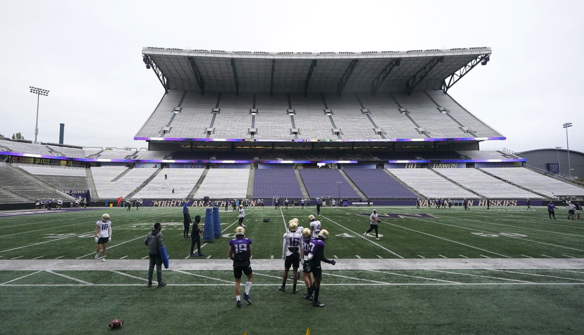 Washington players and coaches take part in NCAA college football practice, Friday, Oct. 16, 2020, at Husky Stadium in Seattle.  (Ted S. Warren)