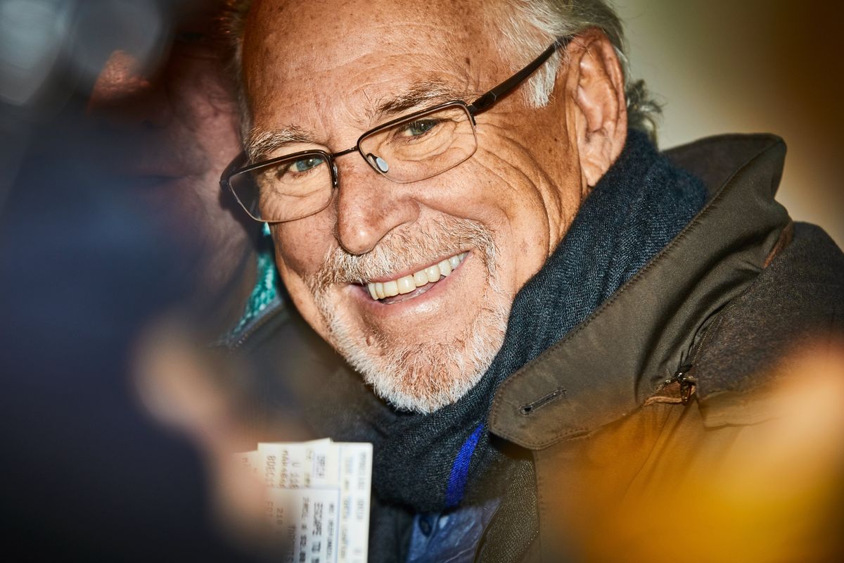 FILE -- Jimmy Buffett with a pair of tickets outside the Marquis Theatre while promoting his musical "Escape to Margaritaville" in New York, Dec. 8, 2017. Buffett, the singer, songwriter, author, sailor and entrepreneur whose roguish brand of island escapism on hits like "Margaritaville" and "Cheeseburger in Paradise" made him something of a latter-day folk hero, especially among his devoted following of so-called Parrot Heads, died on Friday, Sept. 1, 2023. He was 76. (Aaron Richter/The New York Times)  (AARON RICHTER)