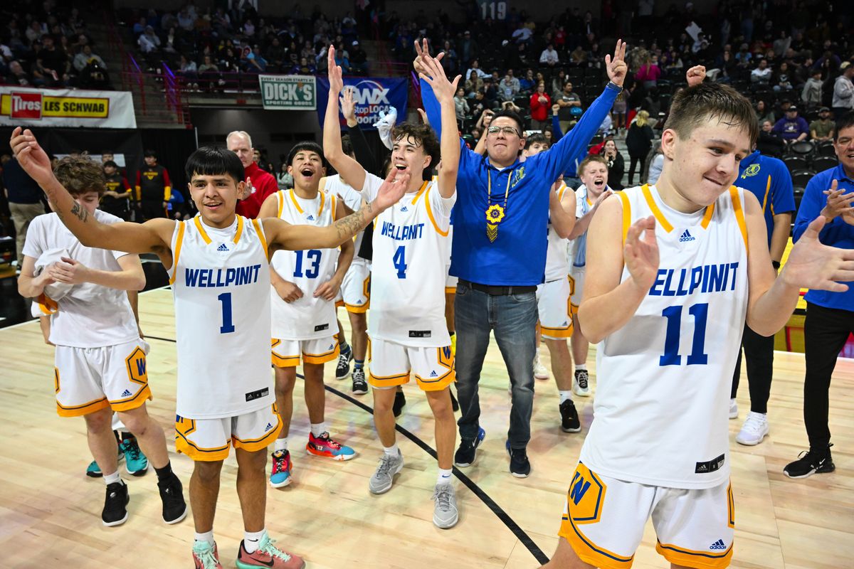 Second-seeded Wellpinit celebrates its 72-57 State 1B semifinal win over fifth-seeded Neah Bay on Friday at the Arena.  (COLIN MULVANY)