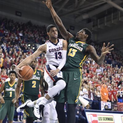 Gonzaga guard Josh Perkins (13) passes against San Francisco’s Dont’e Reynolds during the Bulldogs’ 86-48 West Coast Conference victory over San Francisco on Saturday night at the McCarthey Athletic Center. (Tyler Tjomsland / The Spokesman-Review)