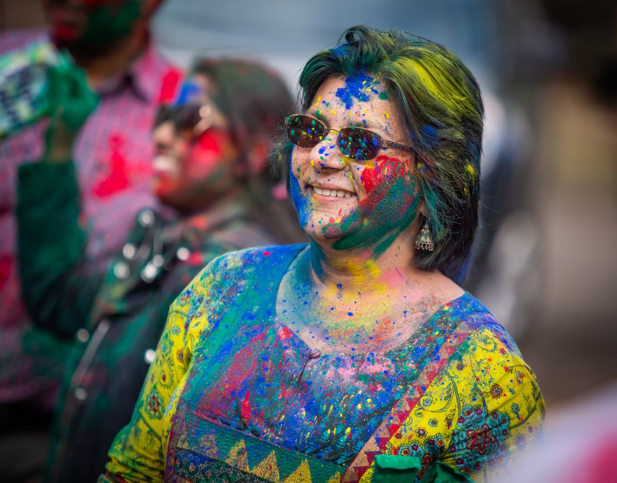 Nalini Gupta celebrates the Festival of Colors for Holi at the interfaith FaVS Center in Spokane on March 8, 2020. The FaVS Center at 5115 S. Freya St. has reopened for gatherings of up to 100 individuals outdoors and up to 30 individuals indoors. Social distancing between households and mask use are required to prevent the spread of the new coronavirus. Choirs are not allowed at this time.  (Libby Kamrowski/The Spokesman-Review)