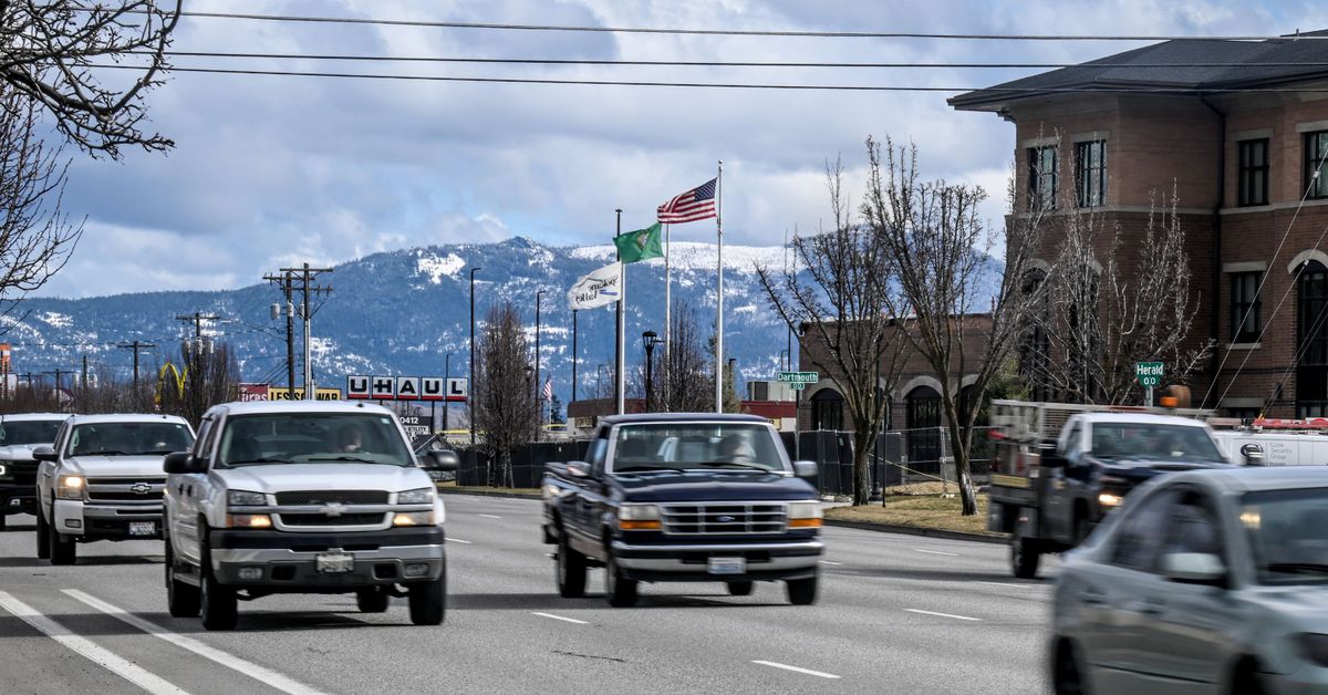 Traffic moves along on Sprague Avenue in front of Spokane Valley City Hall on March 1. As part of the Sprague Avenue Stormwater and Multi-Modal Improvement Project, three blocks of Sprague will be reduced from five lanes to three east of University Road and west to Herald Road.  (Kathy Plonka/The Spokesman-Review)