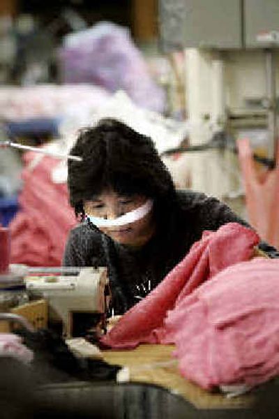 
The American garment industry faces challenges from burgeoning Chinese exports. 
 (Associated Press / The Spokesman-Review)