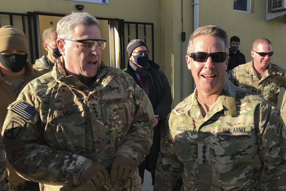 Chairman of the U.S. Joint Chiefs of Staff Gen. Mark Milley, left, talks with Gen. Scott Miller, the commander of U.S. and coalition forces in Afghanistan, Wednesday, Dec. 16, 2020 at Miller’s military headquarters in Kabul, Afghanistan. The top U.S. military officer has held an unannounced meeting with Taliban peace negotiators to push for a reduction in violence in Afghanistan.  (Robert Burns)
