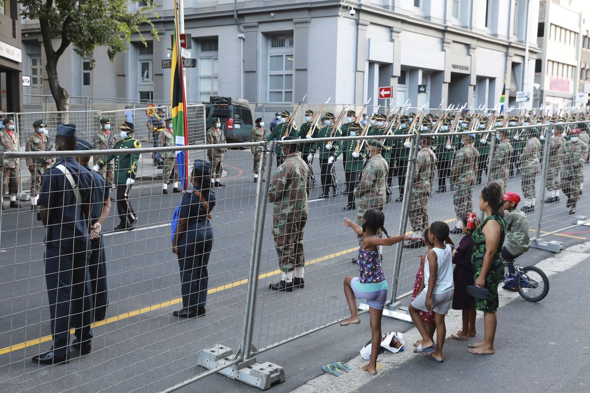 Children look on as President Cyril Ramaphosa