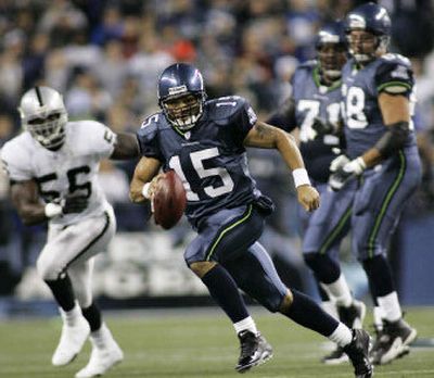 
Seneca Wallace (15) directed the Seattle offense and passed for a touchdown in a 16-0 win over Oakland. 
 (Associated Press / The Spokesman-Review)