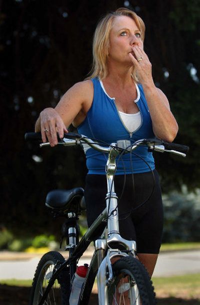
Cindy Finke tries to recall the details of her bike accident last September when she was hit by a Jeep Cherokee during an Ironman training ride. The crash left her severely injured. 
 (Photos by Jed Conklin / The Spokesman-Review)
