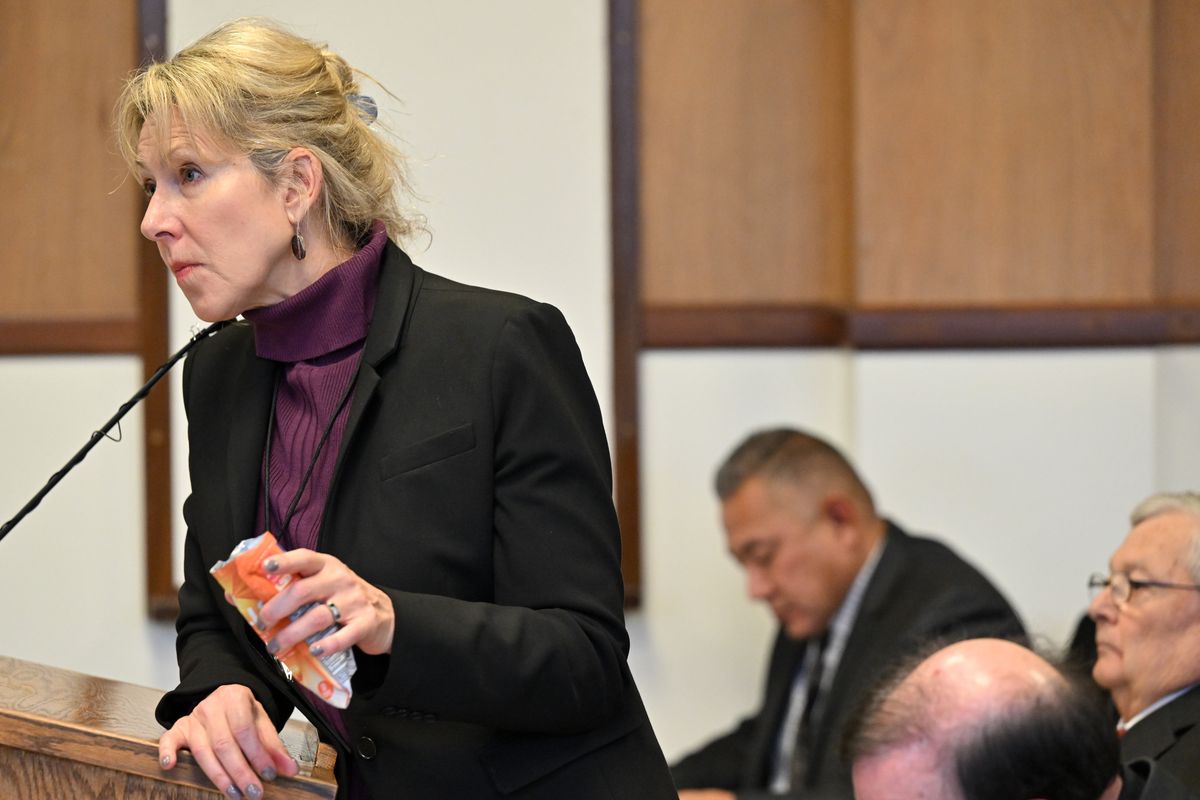 Richard Aguirre’s attorney, Karen Lindholdt, uses a cough-drop package to illustrate an evidence bag into which investigators placed a condom found near where Ruby Doss was killed, while cross-examining an expert witness on DNA evidence on Tuesday in Spokane County Superior Court.  (Tyler Tjomsland/The Spokesman-Review)