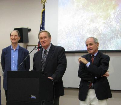 Idaho Sen. Mike Crapo, center, speaks at the National Interagency Fire Center in Boise on Monday; at left is Oregon Sen. Ron Wyden and at right, Idaho Sen. Jim Risch. (Betsy Z. Russell)