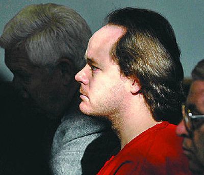 
Paul Earl Hawkins, center, sits with his defense team in a Kootenai County courtroom before being sentenced Friday for his rape spree in 2003. 
 (Jesse Tinsley / The Spokesman-Review)