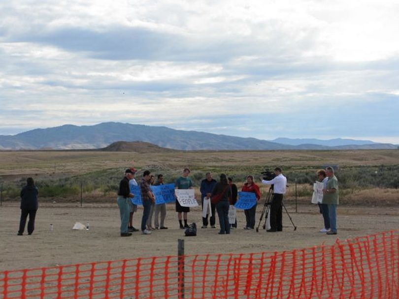 A dozen death penalty opponents gather outside Idaho's state prison gates on Tuesday morning, to protest the execution of Richard Leavitt. (Betsy Russell)