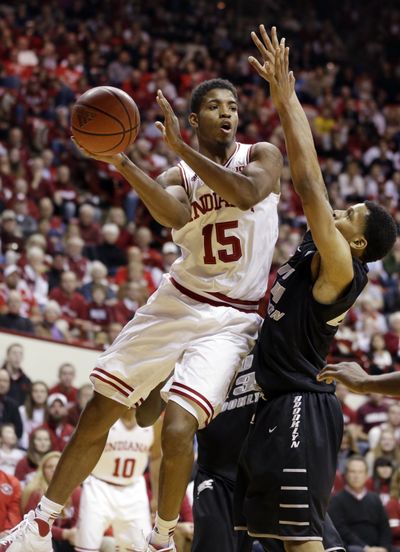 Indiana forward Devin Davis, left, was hospitalized after he was struck by teammate Emmitt Holt’s SUV Saturday morning. (Associated Press)