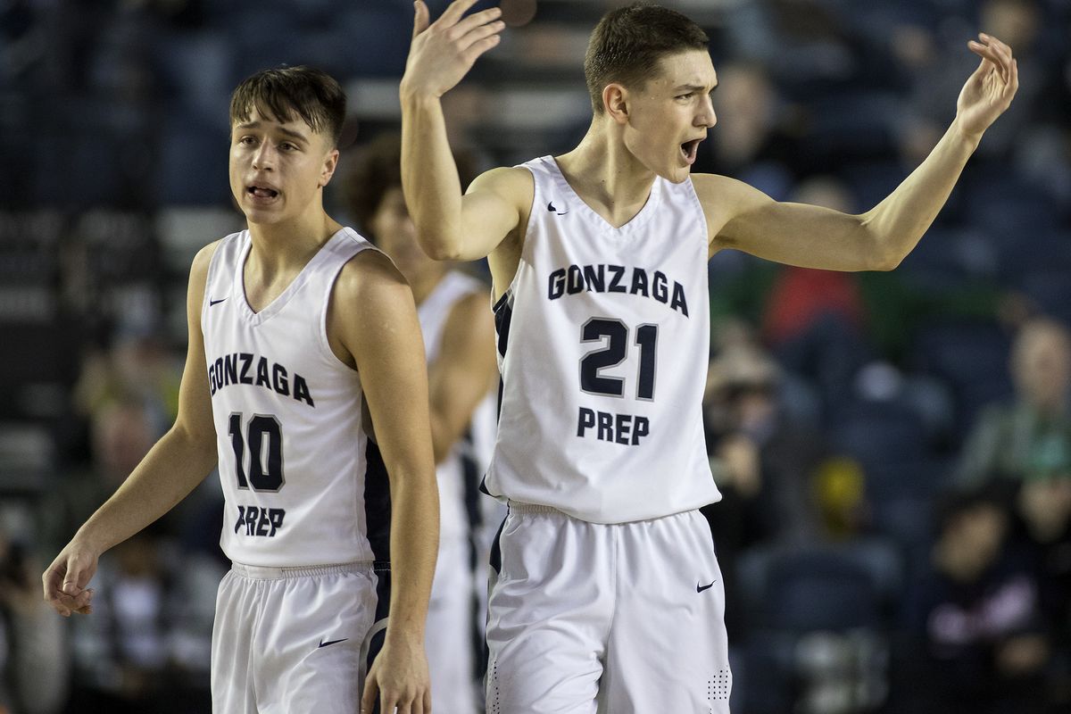 Gonzaga Prep’s Liam Lloyd, right, tells the crowd to get loud as Prep goes on a run to end the first half against Mt. Si in the 4A State championship game on March 2, 2019. 