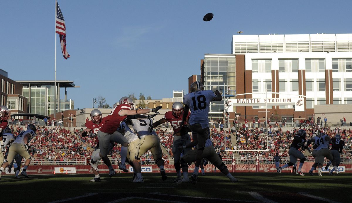 The WSU defense puts pressure on the Montana State punter during second half action at Martin Stadium in Pullman, Wash. Saturday September 11, 2010. (Christopher Anderson / The Spokesman-Review)
