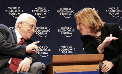
Palestinian President Mahmoud Abbas talks with Israeli Foreign Minister Tzipi Livni on Sunday. 
 (Associated Press / The Spokesman-Review)