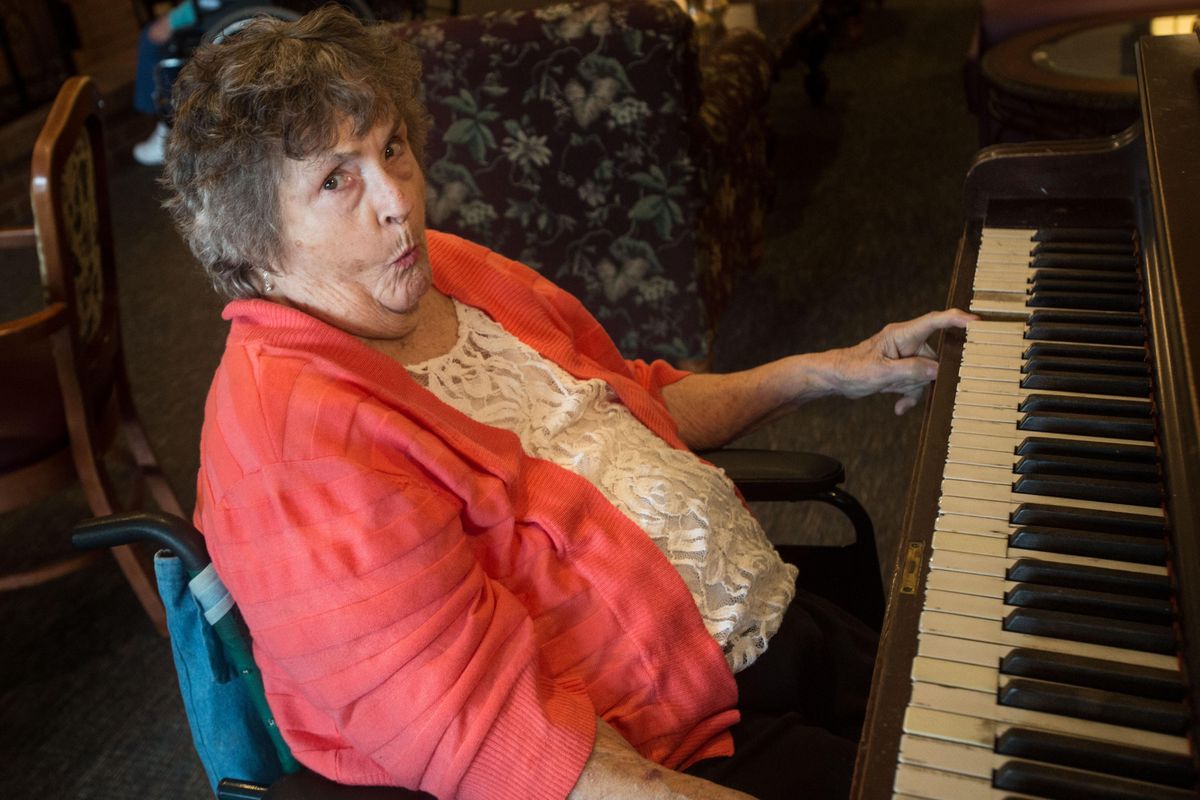 Lois Swoboda poses for the camera after playing a quick song on the piano on Wednesday, May 3, 2017, in Spokane, Wash. (Tyler Tjomsland / The Spokesman-Review)