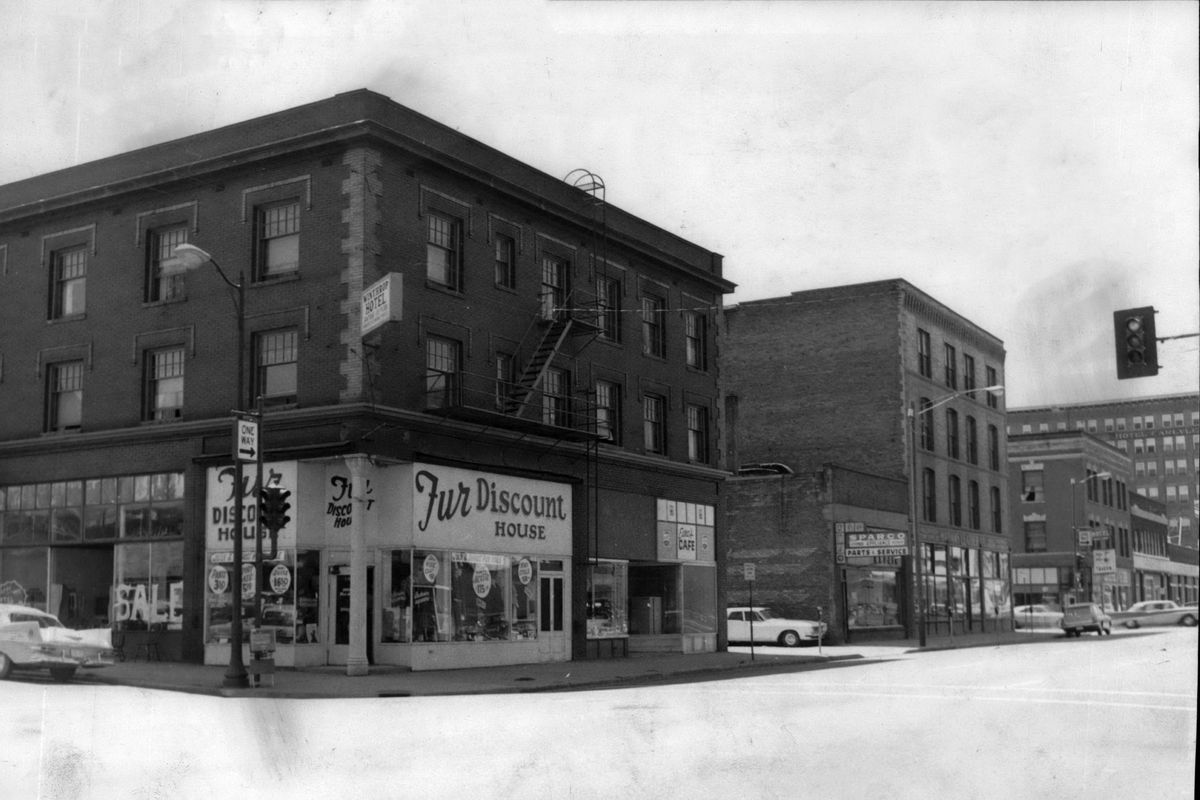 1966 - These three buildings on Second Avenue between Howard and Wall streets - the Winthrop Hotel, Spokane Appliance Repair and Adams Leather Company - were razed  to make room for a modern used auto sales lot for Buchanan Chevrolet. The company acquired a total of four buildings in this block east of the auto dealership