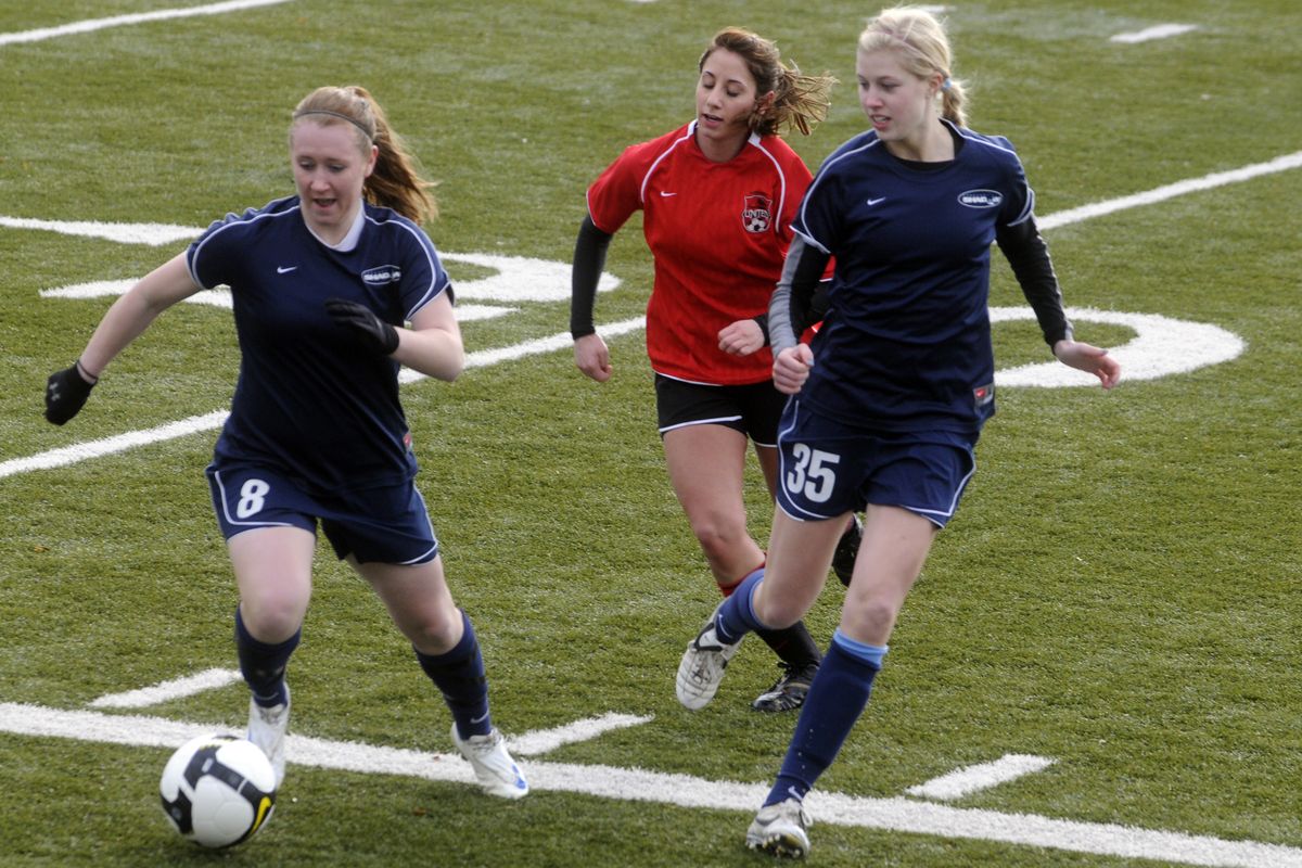 Tanya Baker, No. 8, of Cheney High and McKenzie Schnell, No. 35, Lewis and Clark, are teammates on the U18/U19 Spokane Shadow soccer team. (J. BART RAYNIAK)