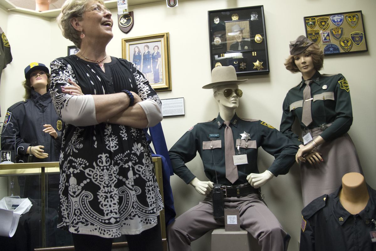Sue Walker, the secretary-treasurer of the Spokane Law Enforcement Museum, looks around at the displays of uniforms and patches Feb. 10. The museum at 1201 W. First Ave. houses uniforms and memorabilia from around the state. (PHOTOS BY JESSE TINSLEY)