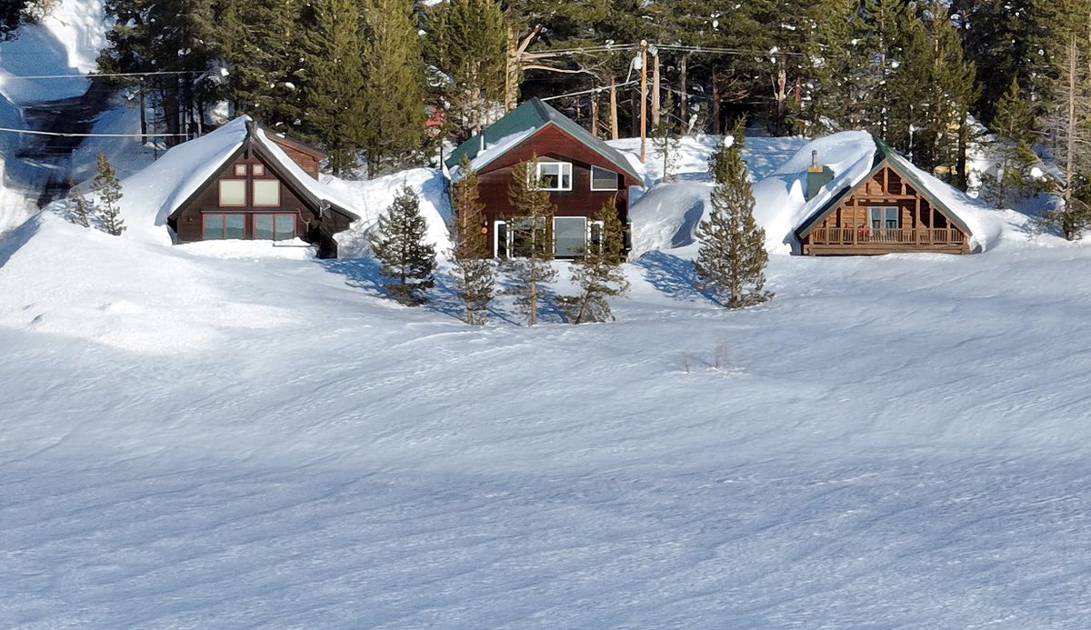 Homes are seen buried in snow in Soda Springs, Calif., on Thursday.  (Josh Edelson/For The Washington Post)