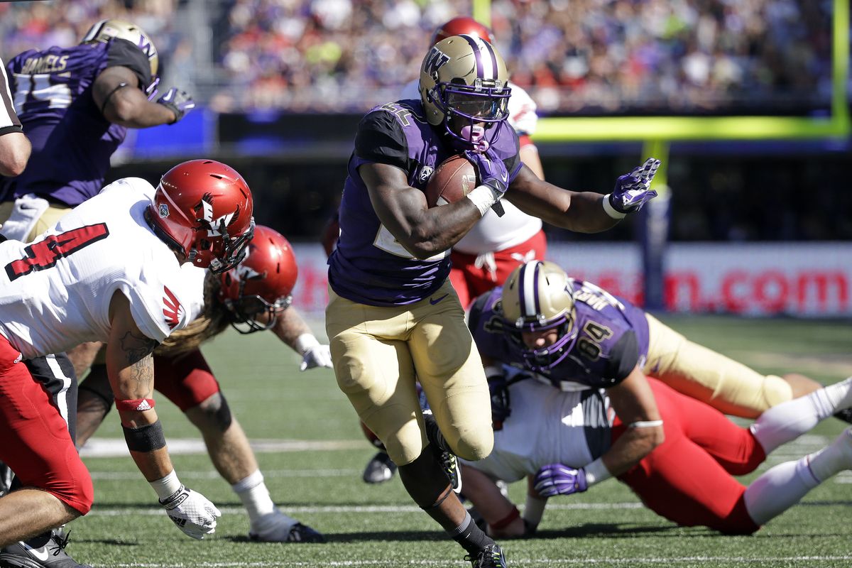 The UW running game ran through the Eastern defense for 356 yards on 57 carries. (Associated Press)