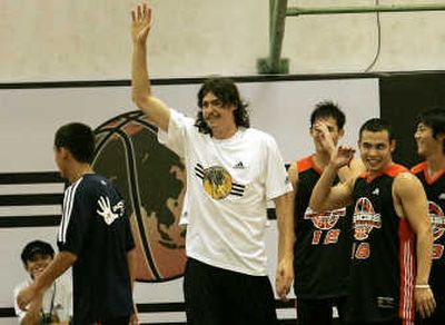 Charlotte's Adam Morrison has spent the off-season as a role model for youth, here helping basketball players in Shanghai, China, and Monday testifying at the JDRF Children's Congress. Associated Press
 (Associated Press / The Spokesman-Review)