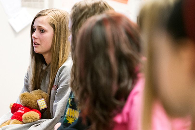 Emily Thomas is emotional when sharing her experience with bullying from a classmate during a girl���s classroom exercise. (Shawn Gust/press)